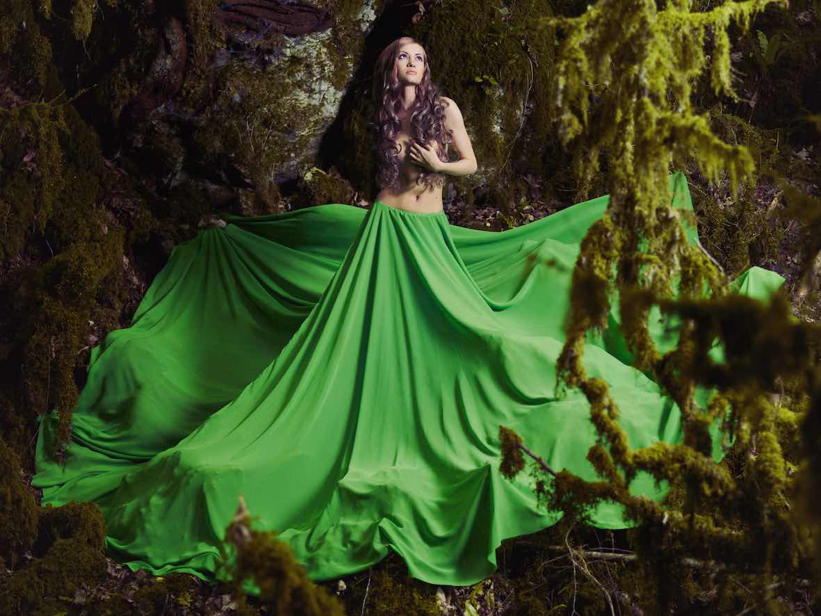 Beautiful nymph in the fairy forest. Fashion photo